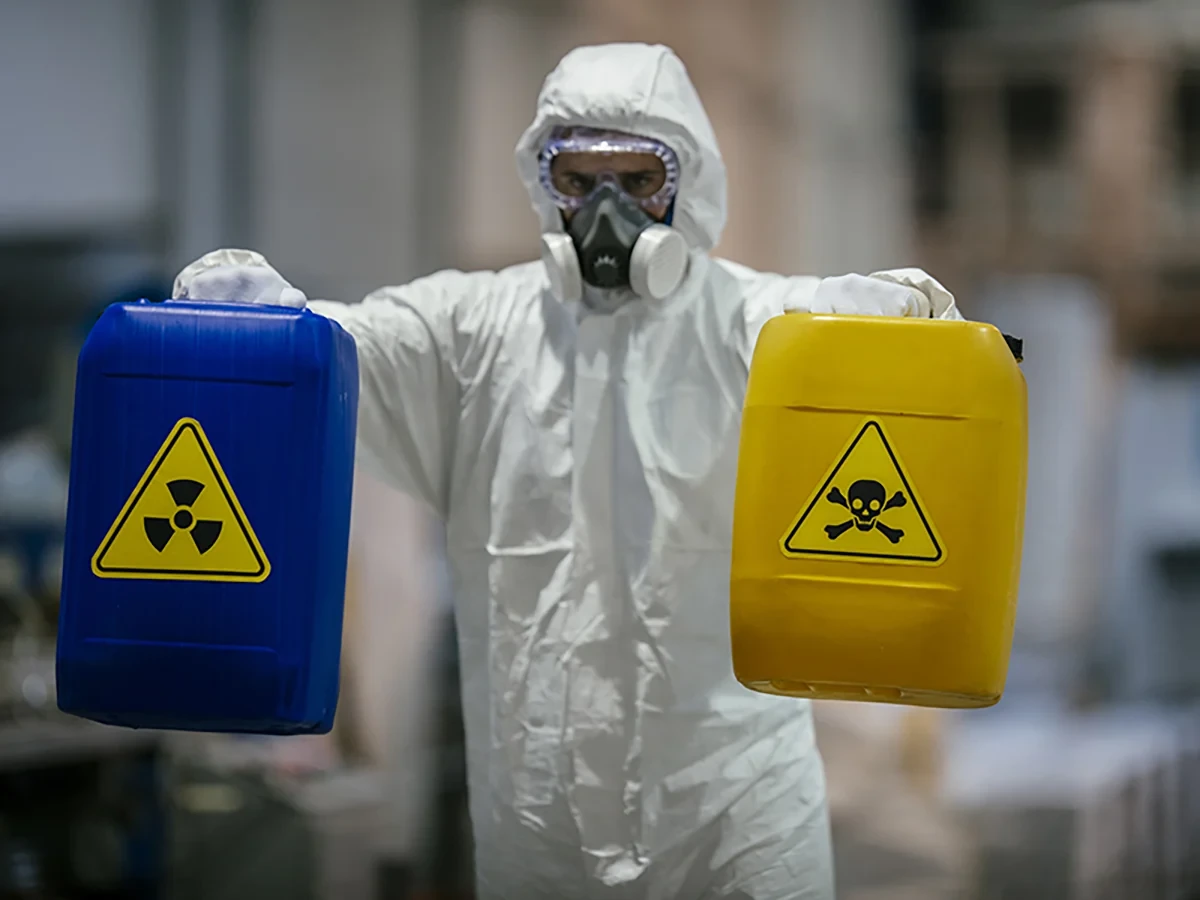 Biohazard cleanup technicians in protective equipment at a remediation scene in Granite City, IL